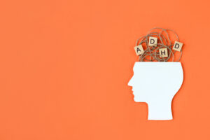 silhouette,of,human,head,and,wooden,blocks,with,the,letters