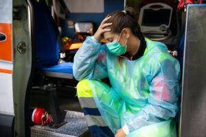 portrait,of,a,young,woman,doctor,sitting,on,the,ambulance