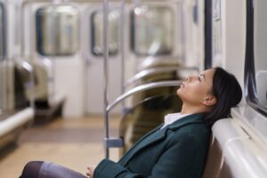 exhausted,american,business,woman,relaxing,resting,on,seat,in,subway